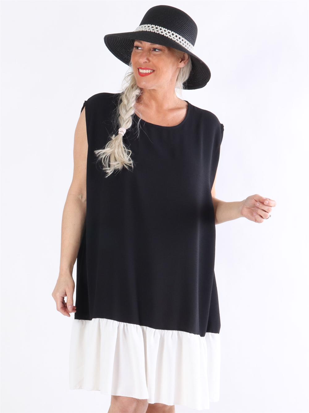 Manola - Kjole i løs pasform med flæsekant forneden